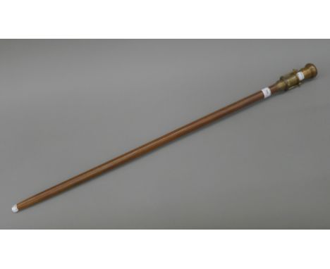 A walking stick mounted with a telescope and compass. 97.5 cm long.