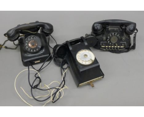 A box of vintage telephones.
