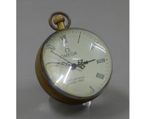 A small ball clock. 7.5 cm high.