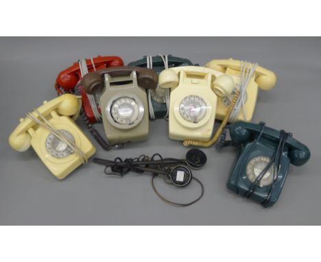 A box of vintage telephones.