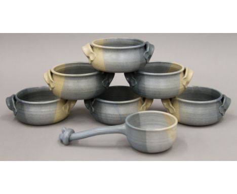 A quantity of Studio Pottery soup bowls and a ladle.