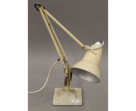 A vintage cream painted anglepoise lamp.