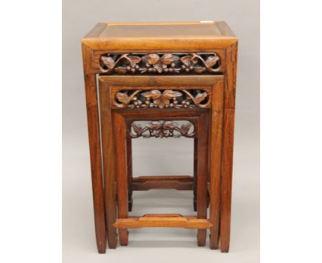 A vintage Chinese rosewood nest of three tables. The largest 38.5 cm wide.