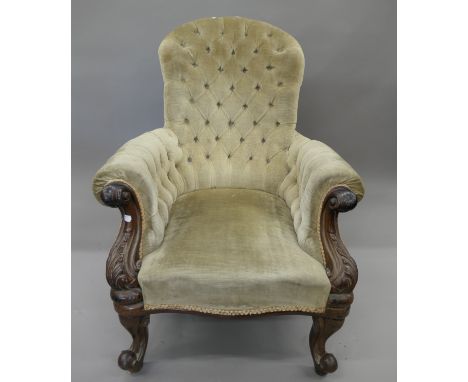 A Victorian mahogany framed upholstered button back open armchair. 73 cm wide.