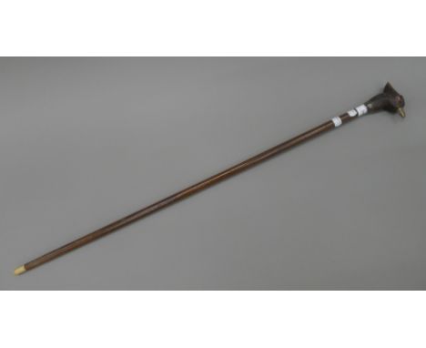 A walking stick, the handle formed as a pheasant head. 92 cm long.