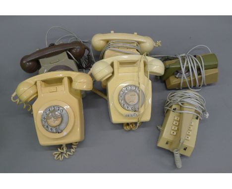 A box of vintage telephones.