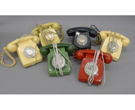 A box of vintage telephones.