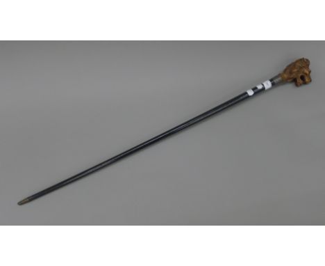 A lion mask handled walking stick. 97.5 cm long.