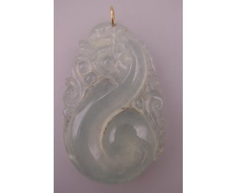 A gold mounted icy jade pendant.  5.5 cm high.