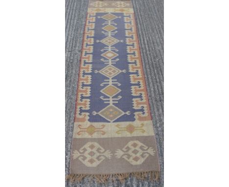A Kilim runner. Approximately 8 x 2 feet.