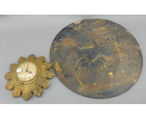 A Smiths sunburst clock, and a Jennens and Bettridge chinoiserie lacquered table top. The former 30 cm diameter.