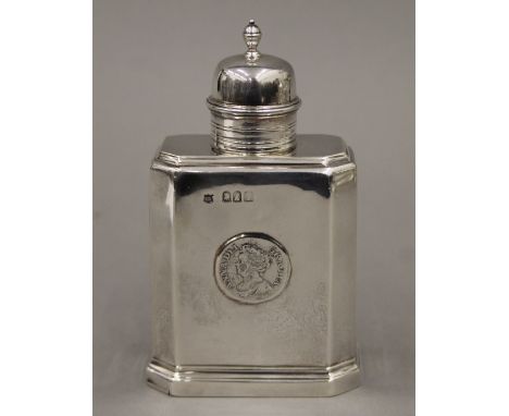 A coin set silver tea caddy. 13.5 cm high. 189.5 grammes.