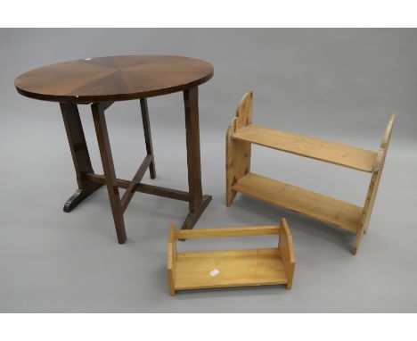 An early 20th century tilt top table, a pine shelf and an oak book rack. 