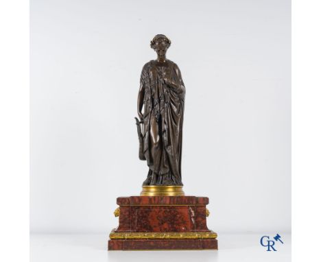 F. Barbedienne Fondeur, a bronze statue in the antique style with brown patina and gilding on a marble pedestal. Numbered wit