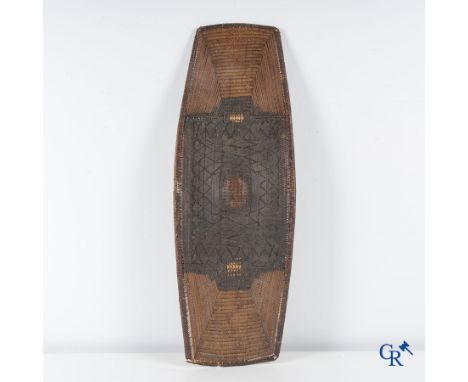 Tribal Art, Republic of Congo, an African shield in wood and wickerwork. | 104 x 36 cm.