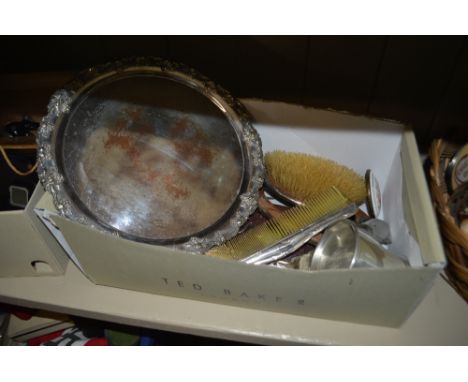 A shoe box containing a silver plated tray, silver mounted dressing table items, various cutlery etc. 