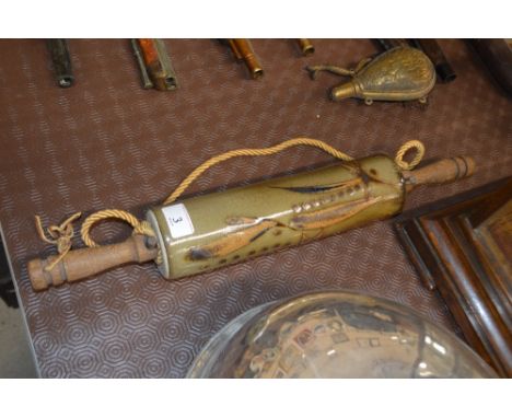 A brown glazed pottery rolling pin with stylised leaf decoration