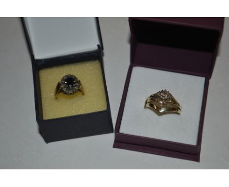 A 9ct gold sapphire set ring; together with a 9ct gold three piece ring