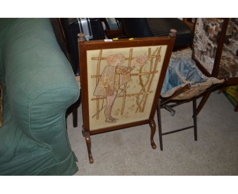 A mahogany framed and tapestry firescreen; and a sewing basket
