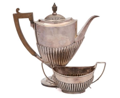 A Victorian silver coffee pot, maker Goldsmiths &amp; Silversmiths Co, Sheffield, 1891: of oval outline with half-reeded deco