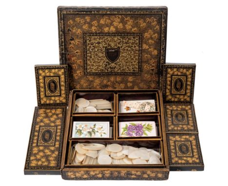 A Cantonese export ware gaming box : of square outline, the lift-off lid enclosing an arrangement of five drawers containing 