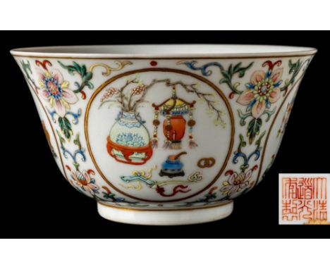 A Chinese famille rose medallion bowl: with flared rim and short cylindrical footrim, the exterior enamelled and gilded with 