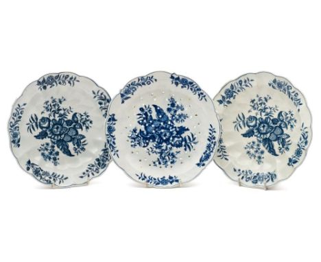 A pair of First Period Worcester blue and white deep plates and a similar cress strainer dish: transfer printed in the 'Pinec