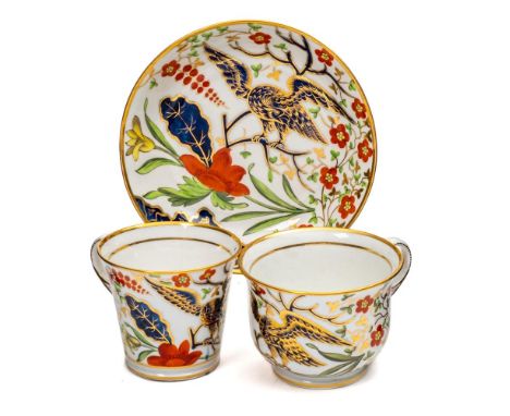 Three Chamberlain Worcester porcelain trios: comprising two cups with 'griffin head' handles and a saucer with a broad yellow