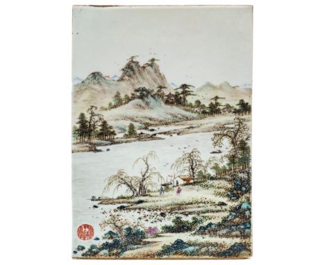 A Chinese porcelain panel: of rectangular form decorated in famille verte enamels with figures in an extensive lakeside lands