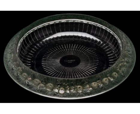 A Rene Lalique shallow dish 'Marguerittes': of circular form, the green patinated rim embossed with daisies, the base acid et