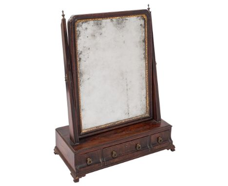 A George III mahogany swing frame platform toilet mirror:, the bevelled plate within a gilt foliate slip and moulded surround