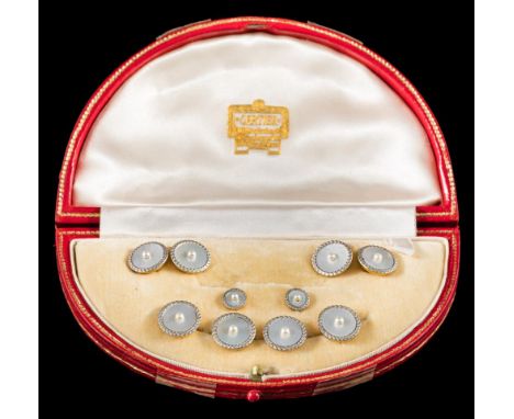 A suite of 18ct gold, mother of pearl and seed-pearl mounted buttons, links and studs: each with a circular mother of pearl p