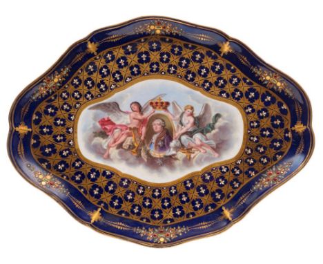 A French Sèvres-style porcelain tray: of shaped oval outline, the centre enamelled with a pair of angels crowning a portrait 