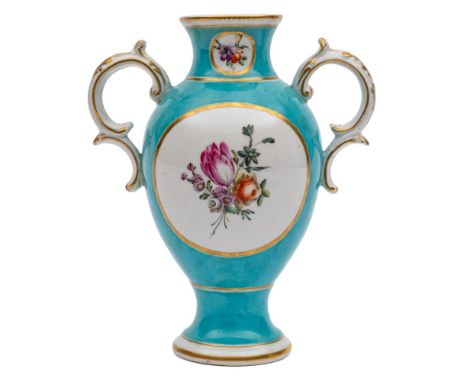 A Chelsea-Derby turquoise ground baluster vase: with rococo scroll handles, painted with panels of floral sprays within gilt 