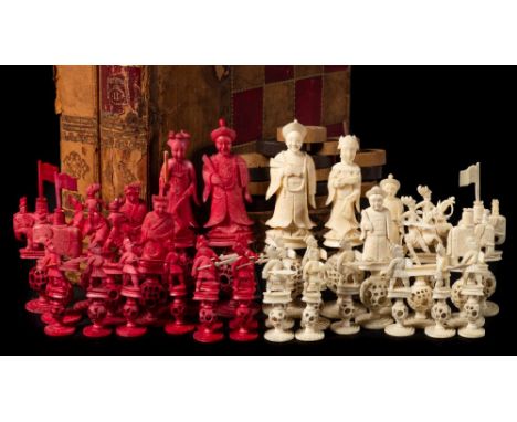 A late 19th century Cantonese Mandarin pattern ivory chess set: one side stained red, the other left natural, the king stands