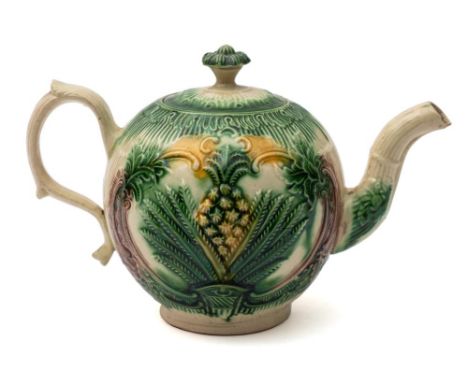 A William Greatbatch lead-glazed creamware teapot and cover: moulded with the 'Basket and Pineapple' pattern, circa 1760-70, 