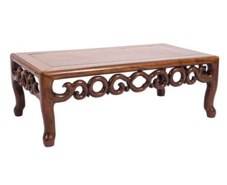 A Chinese Hua Li wood rectangular urn table:, having a pierced scroll frieze on shaped legs, the top 77cm (2ft 6 1/4in) x 41c