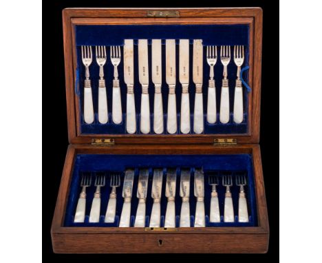 An Edward VII set of twelve silver and mother of pearl handled fruit knives. and forks, maker Harrison Brothers &amp; Howson,