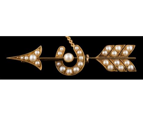 A Victorian seed pearl mounted bar brooch: in the form of an arrow with horseshoe with attached safety chain, un-marked, appr