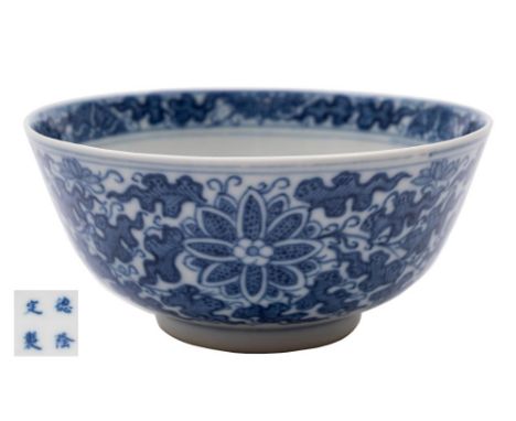 A Chinese blue and white porcelain bowl: the exterior painted with peony and chrysanthemum amongst profuse foliage, the inter