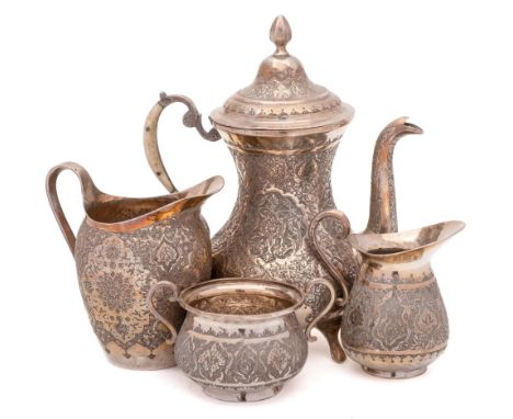 An Indo- Persian three- piece silver tea service: of baluster form with engraved foliate decoration, includes teapot, cream j