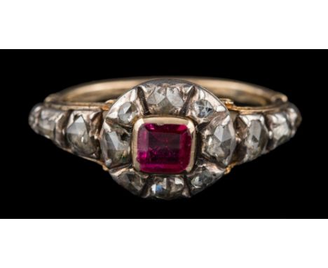 A Georgian ruby and rose diamond cluster ring: the central rectangular ruby approximately 5mm long x 4.5mm wide, within a sur