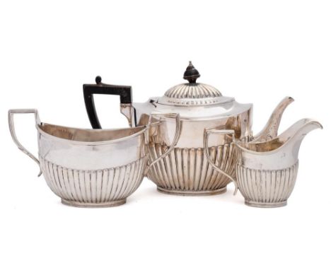 A Victorian silver three-piece tea service, maker Charles Boyton II, London, 1897: of oval outline with half reeded decoratio
