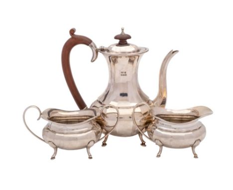 A George V silver three-piece bachelor's tea service, maker Hukin &amp; Heath Ltd, Birmingham, 1928: of barge-shaped outline 