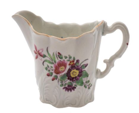 A First Period Worcester 'High Chelsea Ewer' cream jug: with leaf moulded wrythen body and painted a floral spray and sprigs,