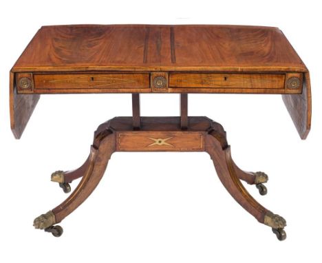 A Regency mahogany, rosewood banded and brass inlaid sofa table:, bordered with lines, the hinged top with canted angles, dec