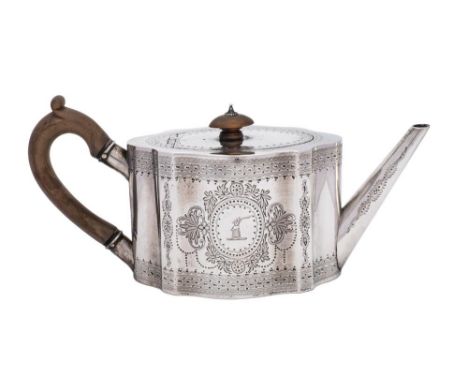A Victorian silver teapot, maker Charles Stuart Harris, London, 1876: crested, of oval outline with foliate cartouches and ba