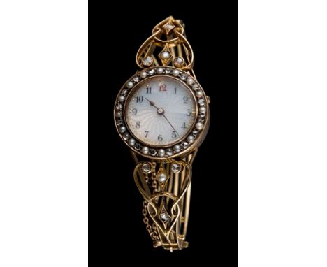 A lady's 19th century hinged bangle watch: the circular guilloche dial with Arabic numerals, within a surround of rose-cut di