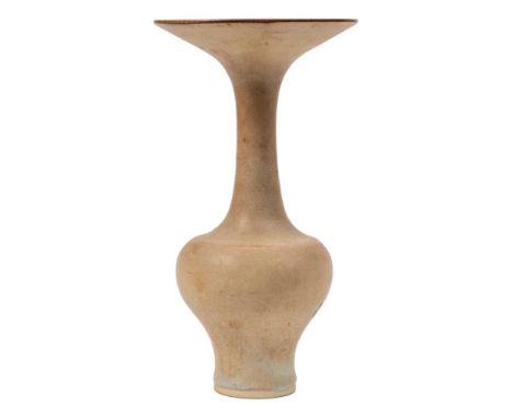 *Lucie Rie DBE (1902-95) a porcelain bottle vase: of baluster form with slender raised neck and flaring rim under pale blue a