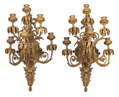 A pair of gilt brass six light wall appliques: the ribbon tied backplates of cartouche-shaped outline with scroll bracket hol